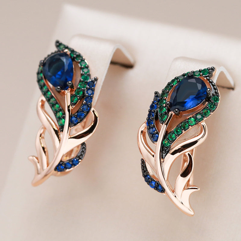 Boucles d'oreilles plumes de paon en or rose 18 Carats avec Shappires